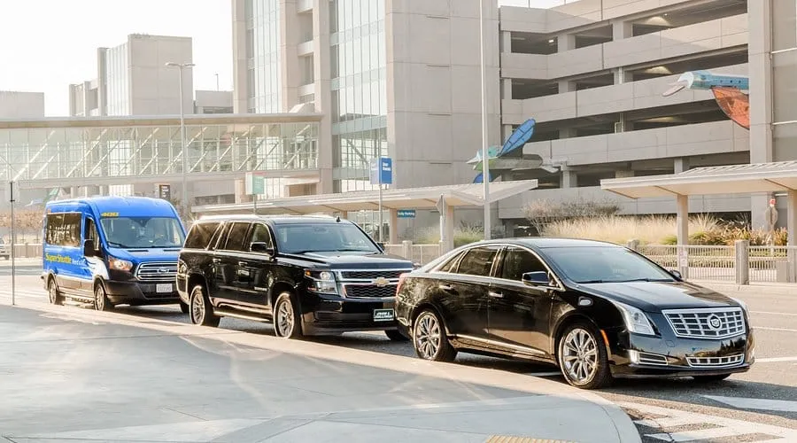 Comparison of private houston to galveston shuttle fleet vs shared vans at the airport terminal.